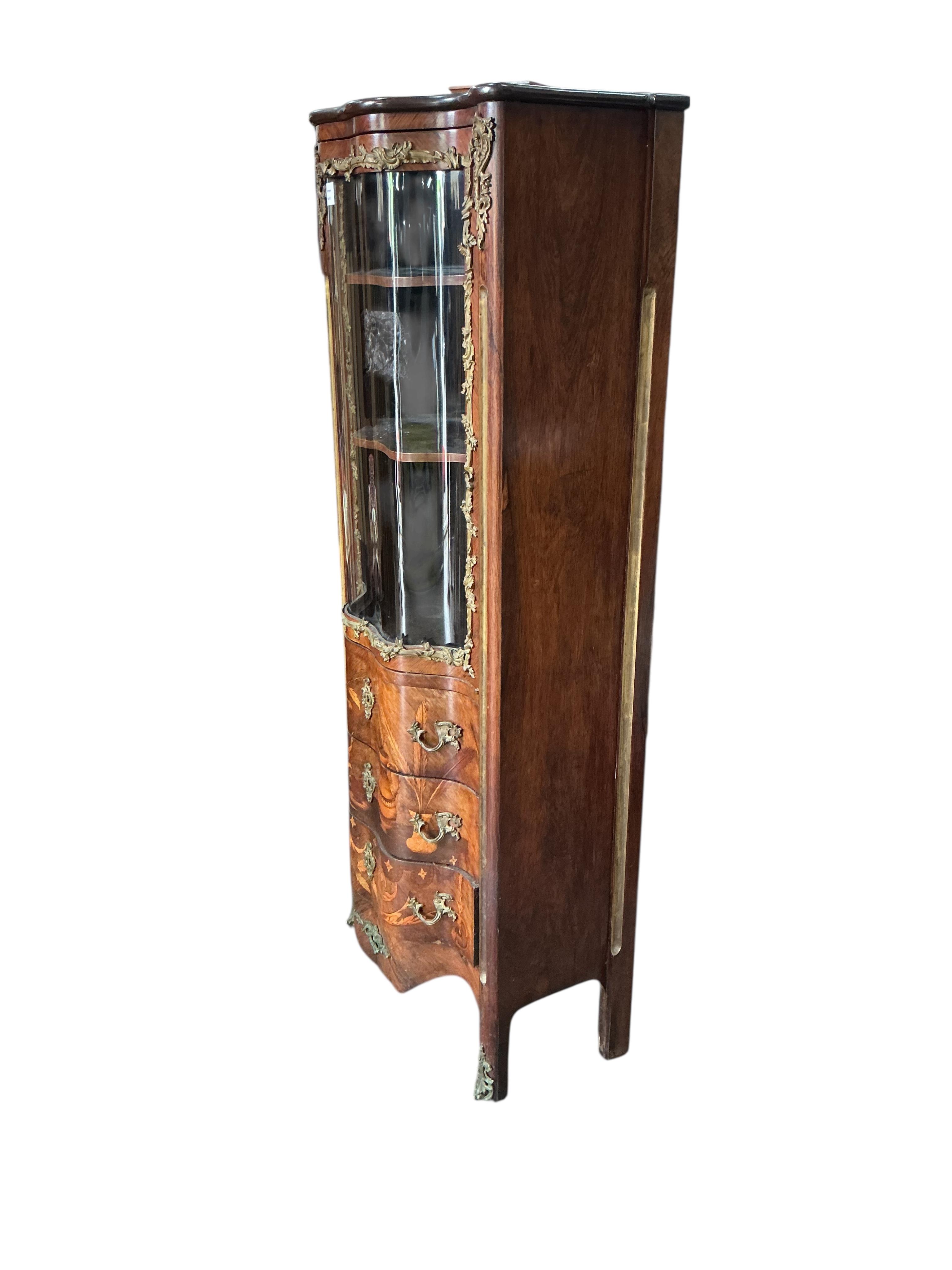 An early 20th century French gilt metal mounted marquetry inlaid rosewood vitrine, width 69cm, depth 38cm, height 164cm